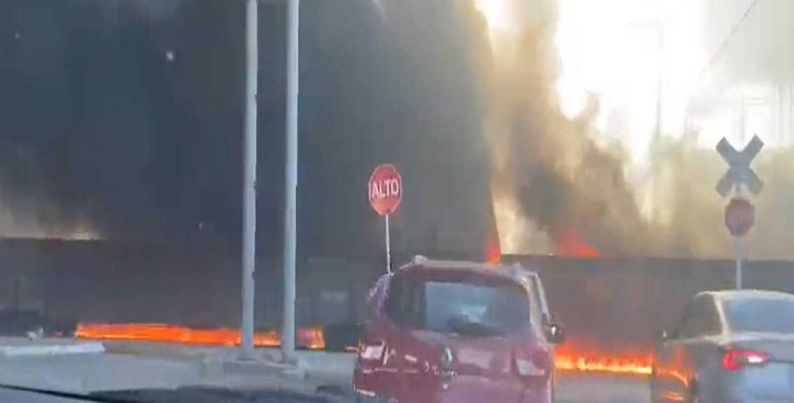 Cargo train drives through flames after crashing into fuel truck in central Mexico