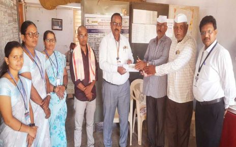 Dr Somnath Gite donating award money to school in Shibalapur